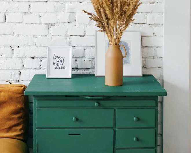 image of drawers,vase,stand picture and bed side